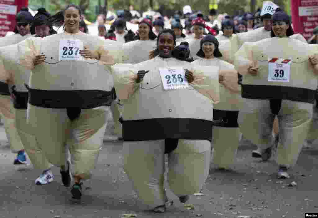 Participants take part in "The Sumo Run" in Battersea Park, London.