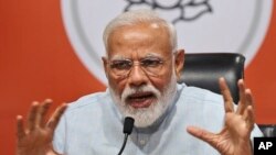 Indian Prime Minister Narendra Modi makes a press statement at the party headquarters in New Delhi, India, May 17, 2019. 