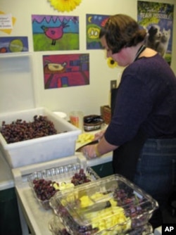 Brook Burnham prepares the daily fruit and vegetable snack at Mettawee Community School in West Pawlet, Vermont.
