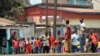 FILE - Demonstrators gather during clashes between security forces and demonstrators at an unauthorized anti-government protest in Conakry, April 20, 2015. 