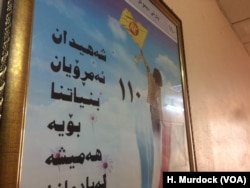 A sign in a ruling Kurdistan Democratic Party office says: "Martyrs, Kurdistan today is a result of your sacrifice. We will always remember you," in Erbil, Kurdish Iraq, Sept. 5, 2017.