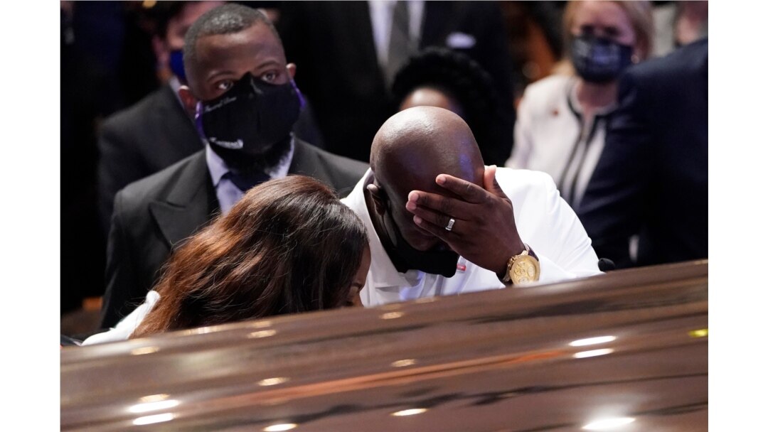 Philonise Floyd, brother, of George Floyd pauses at the casket during a funeral service for Floyd at The Fountain of Praise church, June 9, 2020, in Houston.