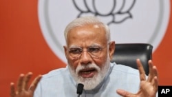 Indian Prime Minister Narendra Modi makes a press statement at the party headquarters in New Delhi, India, May 17, 2019. 