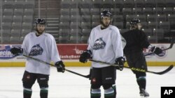 Liam Stewart, second from right, is seen during practice for the Alaska Aces hockey team in Anchorage, Alaska, Oct. 22, 2015.
