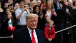 President Donald Trump pauses in front of the press as he and first lady Melania Trump prepare to board Marine One on the South Lawn of the White House in Washington, Jan. 13, 2020.