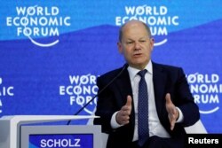 German Chancellor Scholz addresses delegates at the World Economic Forum, in Davos