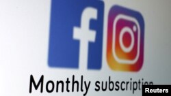 FILE - The logos of Facebook and Instagram and the words "Monthly subscription" are seen in this picture illustration taken January 19, 2023. 