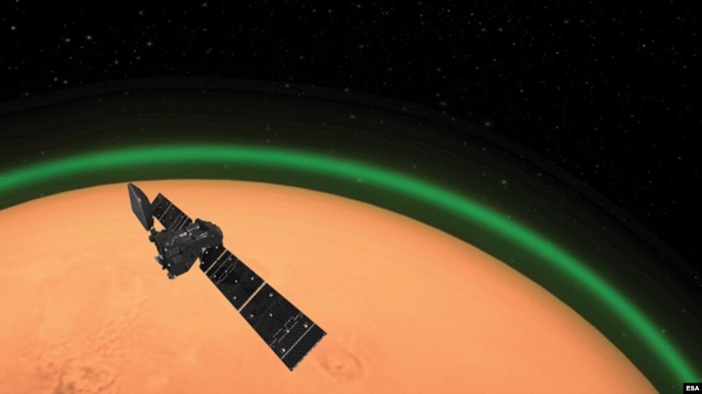 An artist's illustration depicts the ExoMars Trace Gas Orbiter, operated by the European Space Agency, has spotted daylight green oxygen around Mars for the first time. (Credit: ESA)