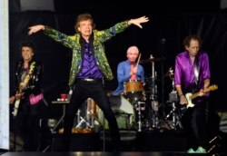FILE - From left, Ron Wood, Mick Jagger, Charlie Watts and Keith Richards of the Rolling Stones perform in Pasadena, California, August 22, 2019.