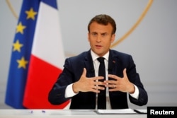 French President Emmanuel Macron responds to a question during a news conference at the Elysee Palace in Paris, April 25, 2019.