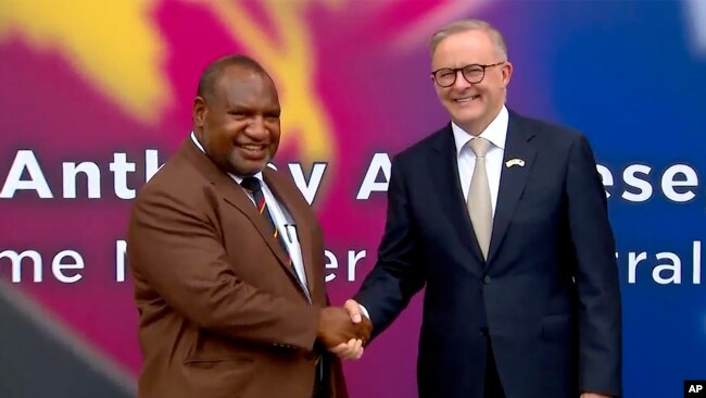 FILE - In this image from a video, Australian Prime Minister Anthony Albanese, left, and Papua New Guinea's Prime Minister James Marape shake hands outside the parliament in Port Moresby, Papua New Guinea, Jan. 12, 2023.