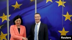 Facebook Chairman and CEO Mark Zuckerberg meets with European Commissioner for Values and Transparency Vera Jourova at the EU Commission headquarters in Brussels, Belgium, Feb. 17, 2020.