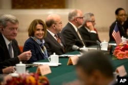 FILE - U.S. House Minority Leader Nancy Pelosi of Calif., second from left, smiles during a bilateral meeting with Zhang Ping, vice chairman of China's National People's Congress, at the Great Hall of the People in Beijing, Nov. 12, 2015.