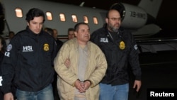 Mexico's top drug lord Joaquin 'El Chapo' Guzman is escorted as he arrives at Long Island MacArthur airport in New York, U.S., Jan. 19, 2017, after his extradition from Mexico. 