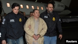 Mexico's top drug lord Joaquin 'El Chapo' Guzman is escorted as he arrives at Long Island MacArthur airport in New York, Jan. 19, 2017, after his extradition from Mexico. 