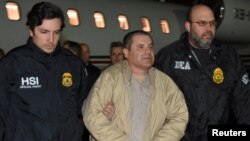 Mexico's top drug lord Joaquin 'El Chapo' Guzman is escorted as he arrives at Long Island MacArthur airport in New York, U.S., Jan. 19, 2017, after his extradition from Mexico. 