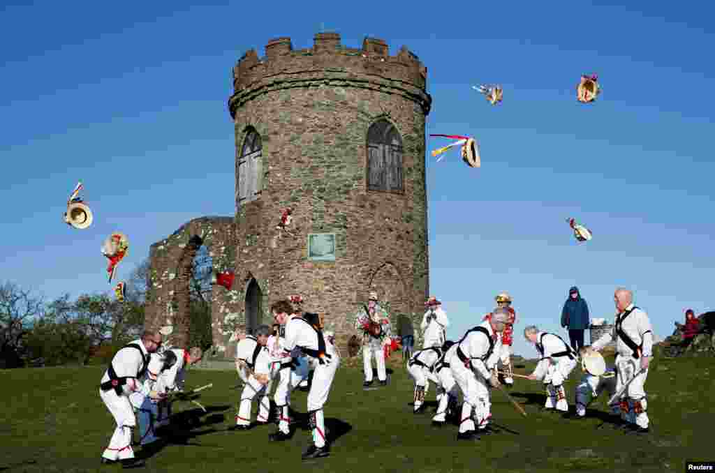 Leicester Morrismen throw their hats during May Day celebrations at Bradgate Park in Newtown Linford, Britain.