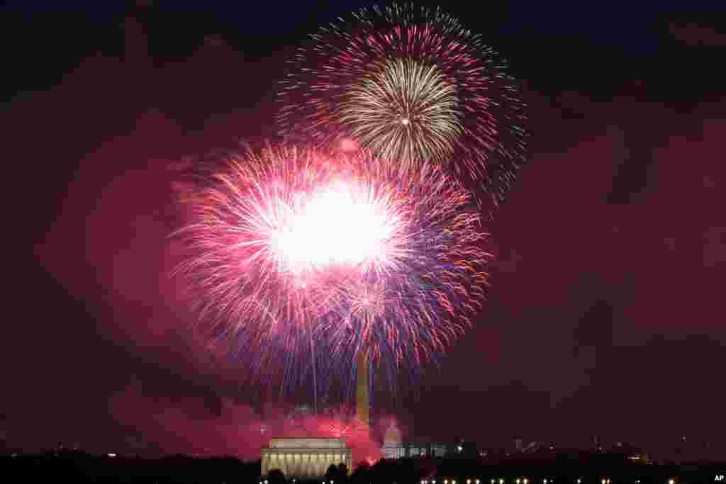Fireworks explode over Lincoln Memorial, Washington Monument and U.S. Capitol, at the National Mall, during the Independence Day celebrations, in Washington, on July 4, 2021.