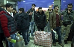 FILE - Afghans who were deported from Germany arrive at Kabul International Airport, Kabul, Afghanistan, Dec. 15, 2016.