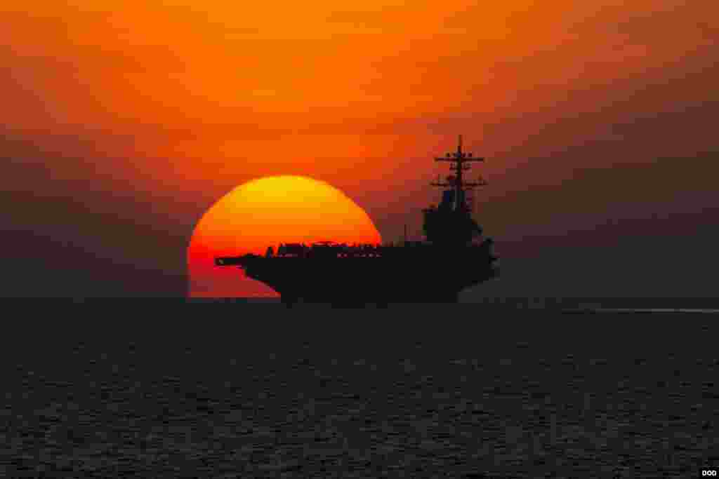 The aircraft carrier USS George H.W. Bush transits the Gulf of Aden as its strike group returns to the naval station in Norfolk, Virginia, after operations in Iraq and Syria. (U.S. Navy photo by Mass Communication Specialist 2nd Class Abe McNatt) 