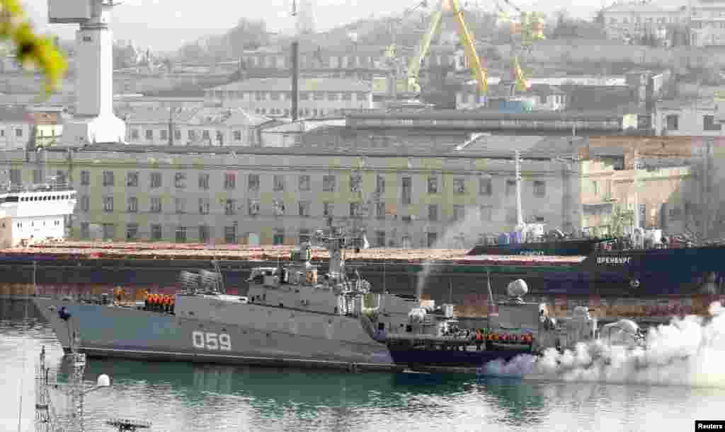 Russian sailors stand onboard the ship Aleksandrovets at the port of Sevastopol, Crimea, March 25, 2014.