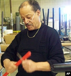 Ed Dwight at work in his studio, preparing the supports for a bronze casting.