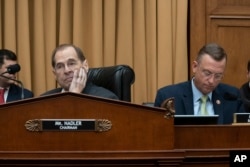 House Judiciary Committee Chairman Jerrold Nadler, D-N.Y., joined at right by Rep. Doug Collins, R-Ga., the ranking member, waits to start a hearing on the Mueller report without witness Attorney General William Barr, who refused to appear, May 2, 2019.