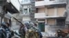 Сирийские власти обстреливают Хомс, не допуская в город Красный Крест