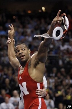 Jordan Burroughs reacts after beating Tyler Caldwell in their 165-pound finals match on March 19, 2011, at the NCAA Division I Wrestling Championships in Philadelphia.