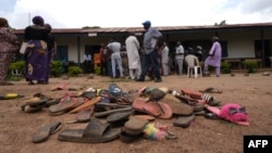 FILE - The belongings of students of Bethel Baptist High School are scattered on school premises as parents of abducted students hope for their return, in the Chikun Local Government Area of Kaduna state, northwest Nigeria, July 14, 2021. 