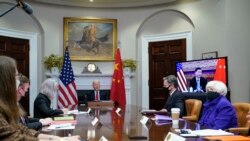 President Joe Biden meets virtually with Chinese President Xi Jinping from the Roosevelt Room of the White House in Washington, Nov. 15, 2021, as Treasury Secretary Janet Yellen, right, and Secretary of State Antony Blinken listen.