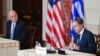 Secretary of State Antony Blinken speaks as Greece's Foreign Minister Nikos Dendias looks on during an event at the State Department in Washington, Oct. 14, 2021.