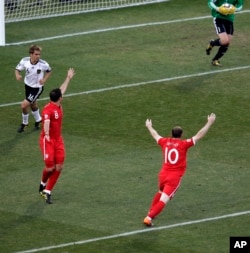England's Wayne Rooney (bottom right) and teammate England's Frank Lampard (second from left) react after a referee disallowed Lampard's goal during the World Cup soccer match between Germany and England, in South Africa, June 27, 2010.