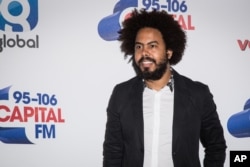 Musician Jillionaire of Major Lazer poses for photographers before performing on stage at the Capital FM Summertime Ball, in London, June 11, 2016.