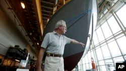 Bruce Harris, volunteer project coordinator, points out features of the hull of PT-305, a World War II patrol torpedo boat, which is being restored at the World War II Museum in New Orleans, March 8, 2016. 