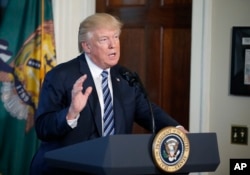 FILE - President Donald Trump speaks at the Treasury Department, April 21, 2017, in Washington.
