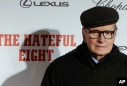 FILE - Composer Ennio Morricone arrives for the screening of the movie "The Hateful Eight," in Rome, Jan. 28, 2016.