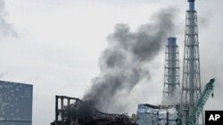 Smoke is seen coming from the area of the No. 3 reactor of the Fukushima Daiichi nuclear power plant in northeastern Japan, March 21, 2011