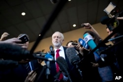 FILE - British Labor party leader Jeremy Corbyn talks to journalists outside the European Commission headquarters in Brussels, Belgium, Sept. 27, 2018.