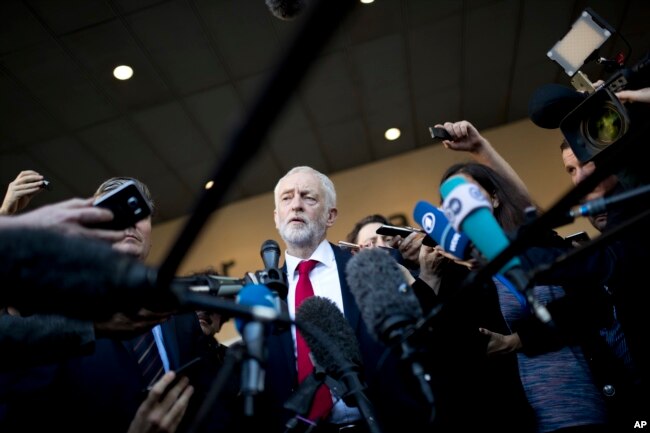 FILE - British Labor party leader Jeremy Corbyn talks to journalists outside the European Commission headquarters in Brussels, Belgium, Sept. 27, 2018.