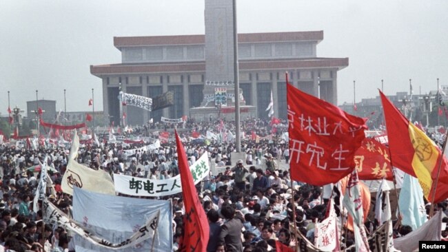 FILE - Hundreds of thousands of people fill Peking's central Tiananmen Square, in front of the Monument to People's Heroes and Mao's mausoleum in the biggest popular upheaval in China since the Cultural Revolution of the 1960's, May 17, 1989.