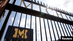 FILE - An entrance to Michigan Stadium is seen on the University of Michigan campus in Ann Arbor, Michigan, Aug. 10, 2020. 