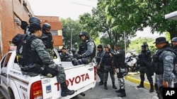 A team of investigators prepare for the searching and tracking of Washington Nationals' catcher Wilson Ramos at the Cuerpo de Investigaciones Cientificas, Penales y Criminalisticas, CICPC, station, in Valencia, Venezuela, November 11, 2011.