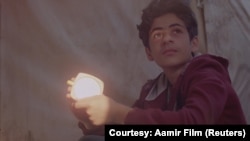 A still taken from BAFTA-nominated short film ‘Aamir,’ showing Aamir (played by Alan Asaad) in Calais, France.