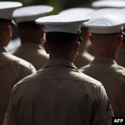 U.S. Marines march in a parade in Honolulu in December to honor Japanese-American veterans of World War Two. Xavier Alvarez claimed he was a retired Marine who won the Medal of Honor.