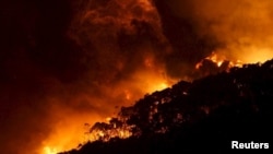 A bushfire burns at Wye River near Lorne, south of Melbourne, Dec. 25, 2015.