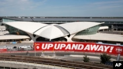 In this Oct. 10, 2017 photo, construction continues on the TWA Hotel at John F. Kennedy International Airport in New York. The hotel at the long-closed TWA Flight Center will conjure the glamour of air travel in 1962 when architect Eero Saarinen’s jet-age landmark first opened. 