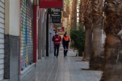 Felix Sesay, a volunteer with the Red Cross, takes food to elderly people who are classified as high risk from coronavirus in Torrent, a town near Valencia. (Photo courtesy of Toni Tomas, Spanish Red Cross)