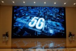 A 5G logo is displayed on a screen outside the showroom at Huawei campus in Shenzhen city, China's Guangdong province.