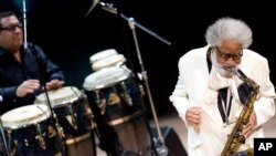 American tenor saxophonist Sonny Rollins, right, performs with drummer Sammy Figueroa in Budapest, Hungary, Nov. 10, 2011. The Jazz Foundation of America honored Rollins with a lifetime achievement award Oct. 22, 2015. 